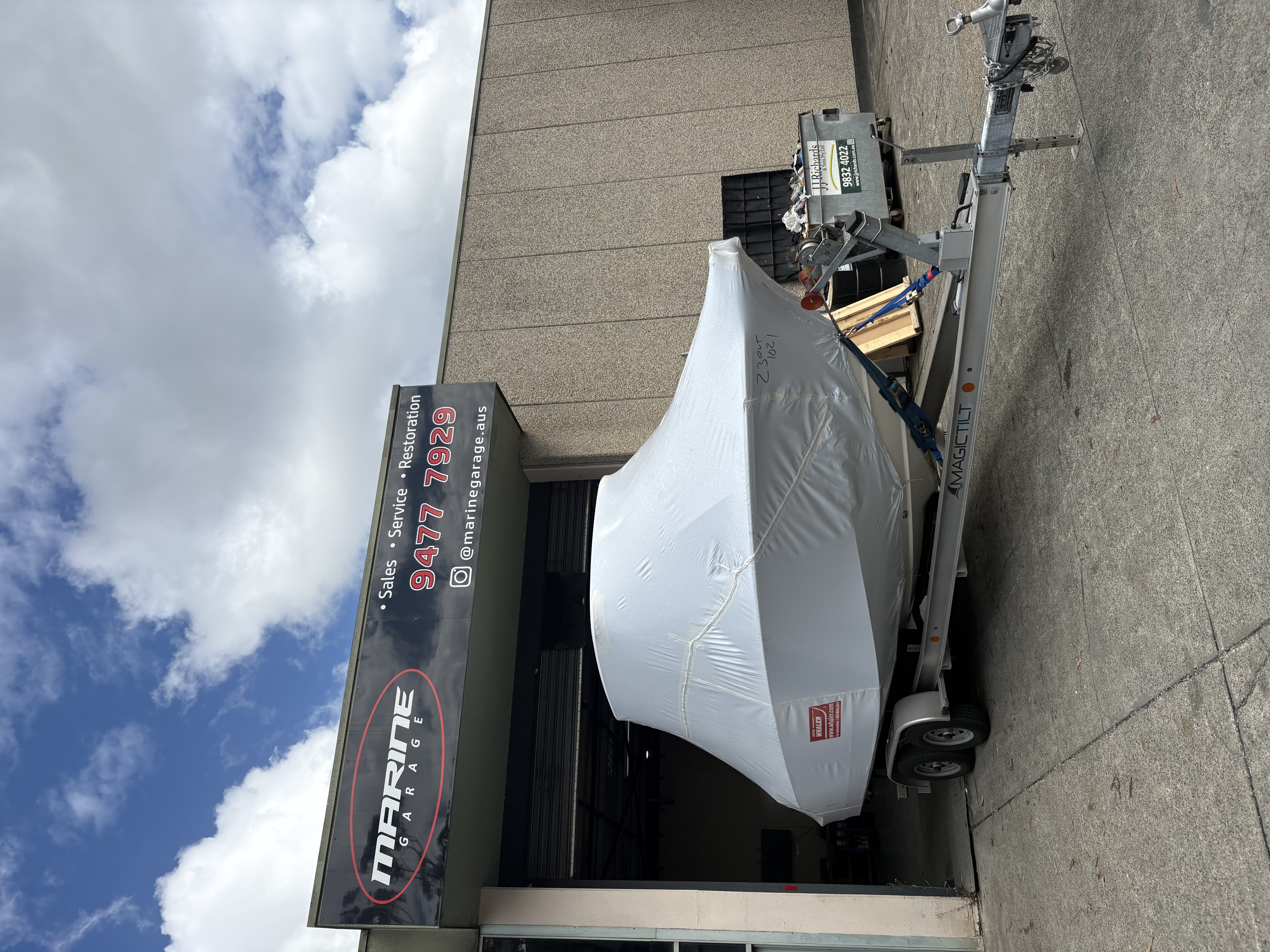 Wrapped boat outside shop