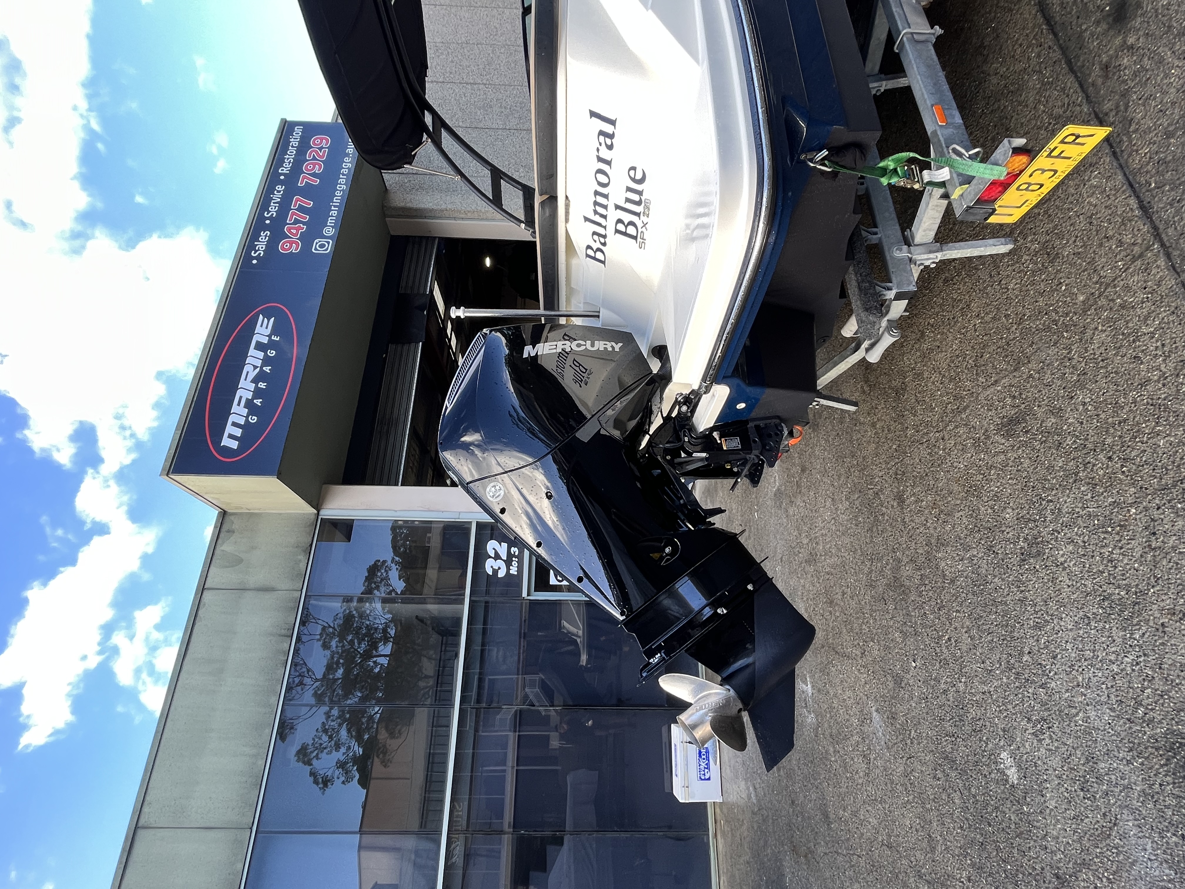 Balmoral Blue boat with Mercury